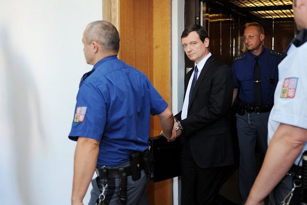 Czech politician David Rath (in the middle) guided by the prison service to court, Prague, Czech republic, August 14, 2013. Rath is accused of corruption. 